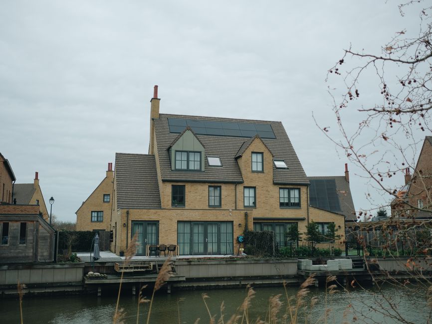 Modern house with high-efficiency solar panels installed on the roof